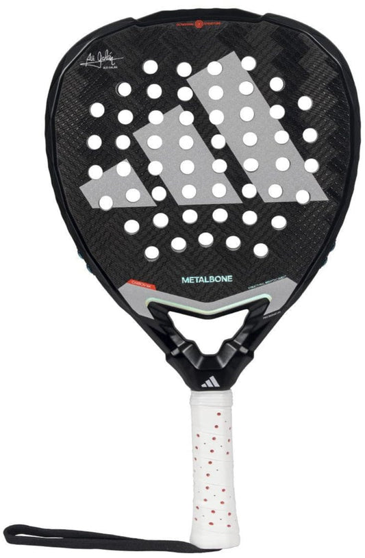 The adidas Metalbone 3.4 Padel Racket features a black frame with white and gray accents, circular holes, a white grip with red dots, and a black wrist strap—engineered for advanced power and top-level performance.