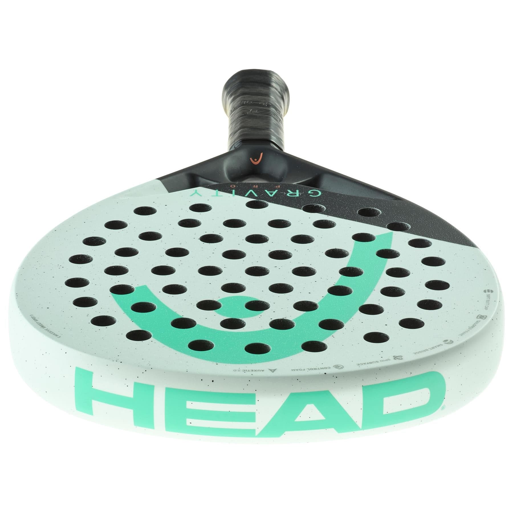 A close-up of the HEAD Gravity Pro 2024 Padel Racket by HEAD shows its light gray body, black handle, green logo, and round holes on the face, featuring advanced Auxetic 2.0 technology for enhanced performance.