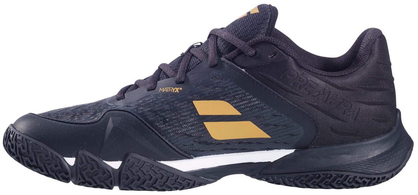 The Babolat Premura 3 Men's Padel Shoes in black and gold feature a textured sole, mesh upper, lace-up closure, and low-cut design by Babolat—ideal for both sports and casual wear.