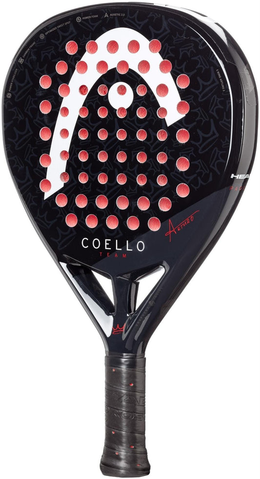 The HEAD Coello Team 2025 Padel Racket features a black and red design, large logo, multiple circular holes, and “Coello Team” branding. Enhanced with HEAD’s Auxetic 2.0 technology for outstanding performance.