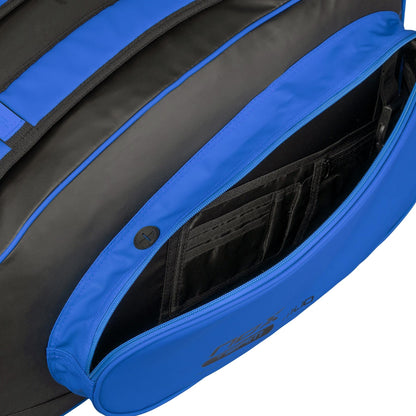 Close-up of the NOX ML10 Team Padel Racket Bag - Black / Blue by NOX with an open zippered pocket, showing organized compartments and slots—ideal for keeping small personal items or accessories secure.