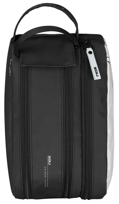 The NOX Luxury Travel Kit Bag - Black/Grey features two zippered compartments, a top handle, and branded "NOX" zipper pulls—perfect as a multi-purpose organiser for your essentials.