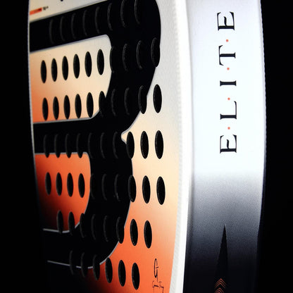 Close-up of the Bullpadel Elite W 2026 Padel Racket edge, displaying "ELITE" in vertical black letters on white, with a textured black and orange pattern and circular holes—a lightweight option from Bullpadel.