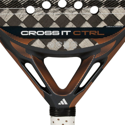 Close-up of the adidas Cross It Ctrl 2026 Padel Racket, a carbon fibre racket with "CROSS IT CTRL" text, black, brown, and orange accents, Spin Blade Mould finish, triangular openings, and part of the iconic adidas logo.