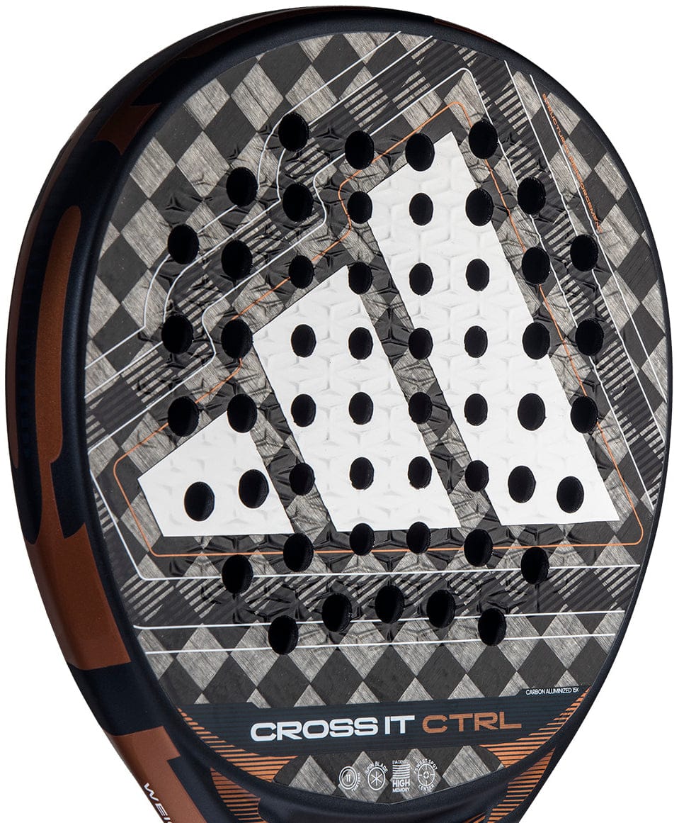 Close-up of the adidas Cross It Ctrl 2026 Padel Racket, showing its black, white, and gray carbon fiber checkered pattern, adidas logo, Spin Blade Mould surface with circular holes, and "CROSS IT CTRL" near the bottom edge.