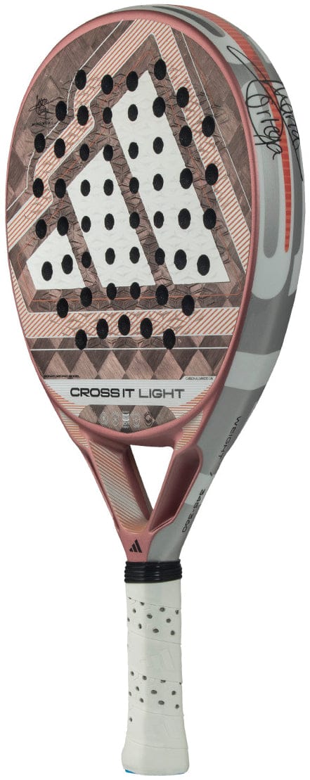 The adidas Cross It Light 2026 Padel Racket features a brown, gray, and white design, a perforated carbon fibre surface, signature on the upper right, and a wrapped grip handle.