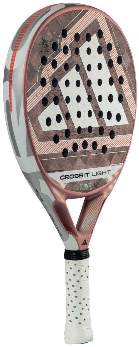 The adidas Cross It Light 2026 padel racket features a white and rose gold geometric design, carbon fibre build, multiple circular holes, and "CROSS IT LIGHT" printed on the bridge above the handle.