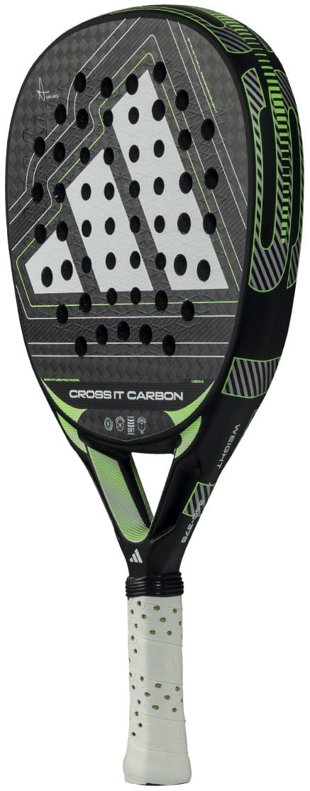 The adidas Cross It Carbon 2026 Padel Racket features a black and green design with white accents, triangular styling, round holes, a white grip, carbon fibre build, and displays the "Cross It Carbon" name plus adidas logo. Advanced level.