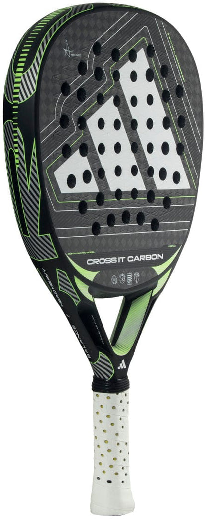 The adidas Cross It Carbon 2026 Padel Racket features a black and green carbon fibre design, perforated surface, white accents with "CROSS IT CARBON" on the face, and a white grip—ideal for advanced players seeking precision and power.