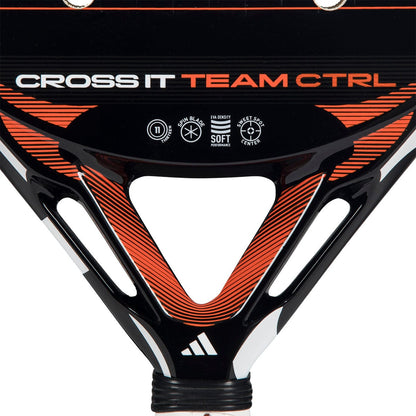Close-up of the adidas Cross It Team Ctrl 2026 Padel Racket in orange and black, featuring the "CROSS IT TEAM CTRL" text and highlighting its premium fibreglass construction.