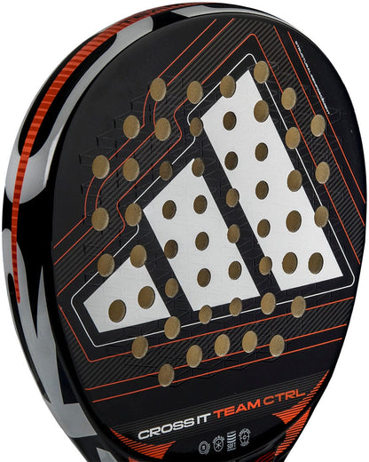 Close-up of the adidas Cross It Team Ctrl 2026 Padel Racket featuring fibreglass construction, black, red and white accents, a bold geometric pattern, and "CROSS IT TEAM CTRL" printed near the bottom edge.