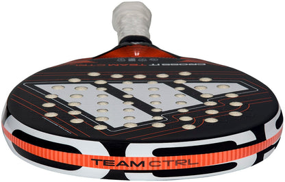 A close-up of the adidas Cross It Team Ctrl 2026 Padel Racket, featuring a black and white fibreglass frame with orange accents, patterned holes on the face, "TEAM CTRL" on the side, and a prominent silver design.