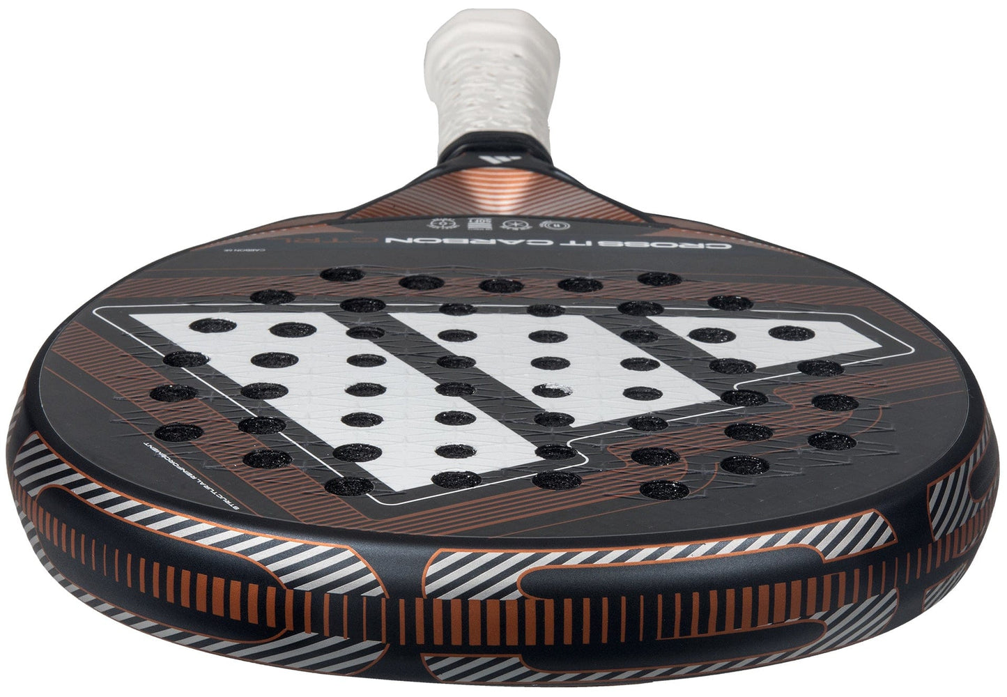 Close-up of the adidas Cross It Carbon Ctrl 2026 Padel Racket, showcasing its black and copper design, carbon fibre face with round perforations, and a white Extra Power Grip on the handle.