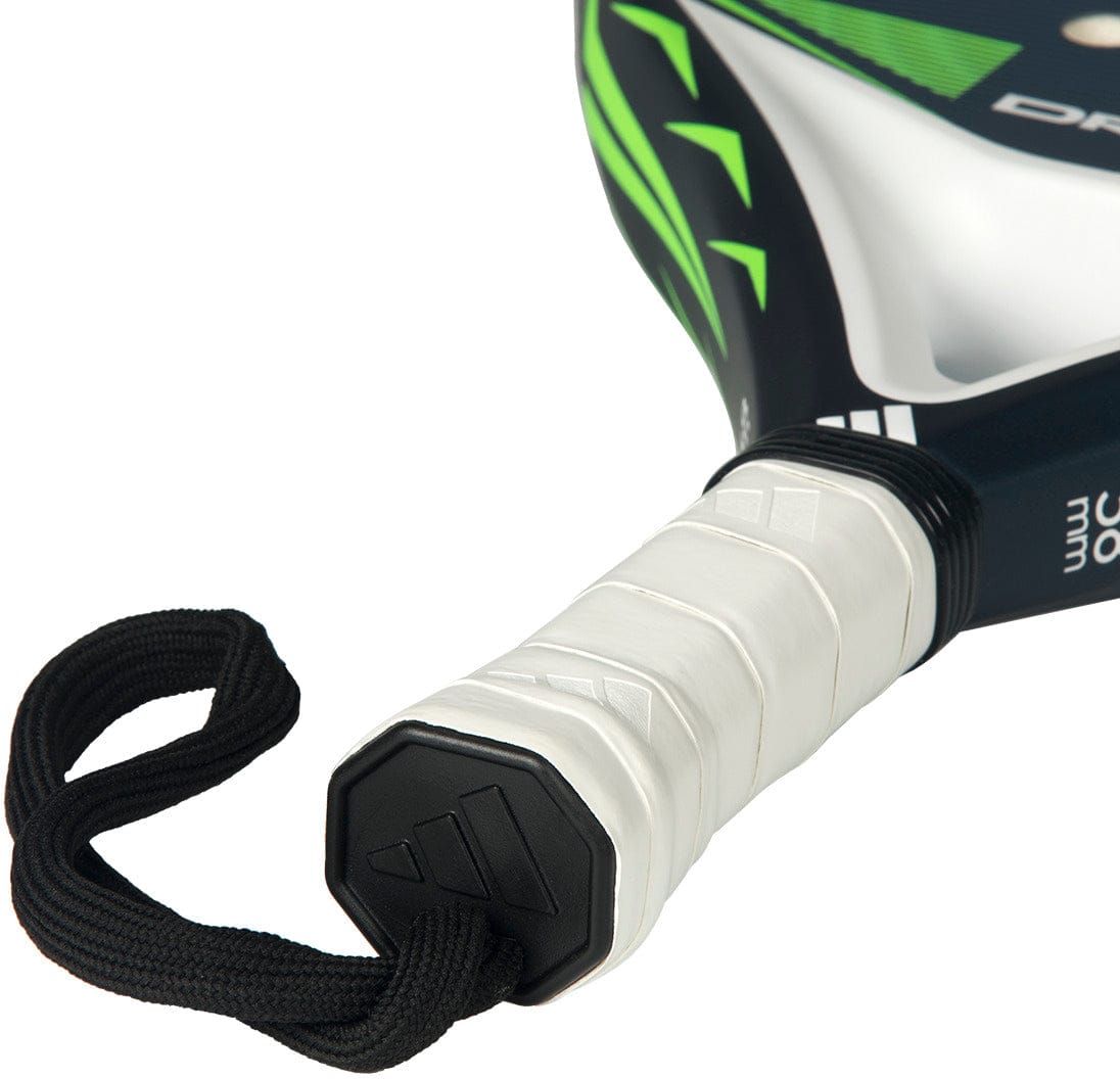 Close-up of the adidas ADIDAS Drive Blue 2026 Padel Racket handle with white grip tape and black wrist strap, featuring green, black, and white accents on the racket head.