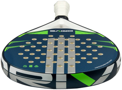 A close-up of the adidas Drive Blue 2026 Padel Racket, a modern beginner racket featuring a blue and green design with circular perforations and "DRIVE" printed near its white grip tape handle.