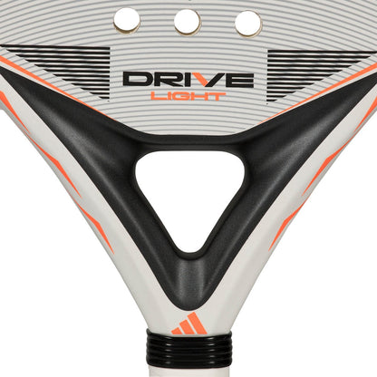Close-up of the adidas ADIDAS Drive Light 2026 Padel Racket, highlighting its lightweight design, white and black colors with orange accents, and three round holes near the top edge.