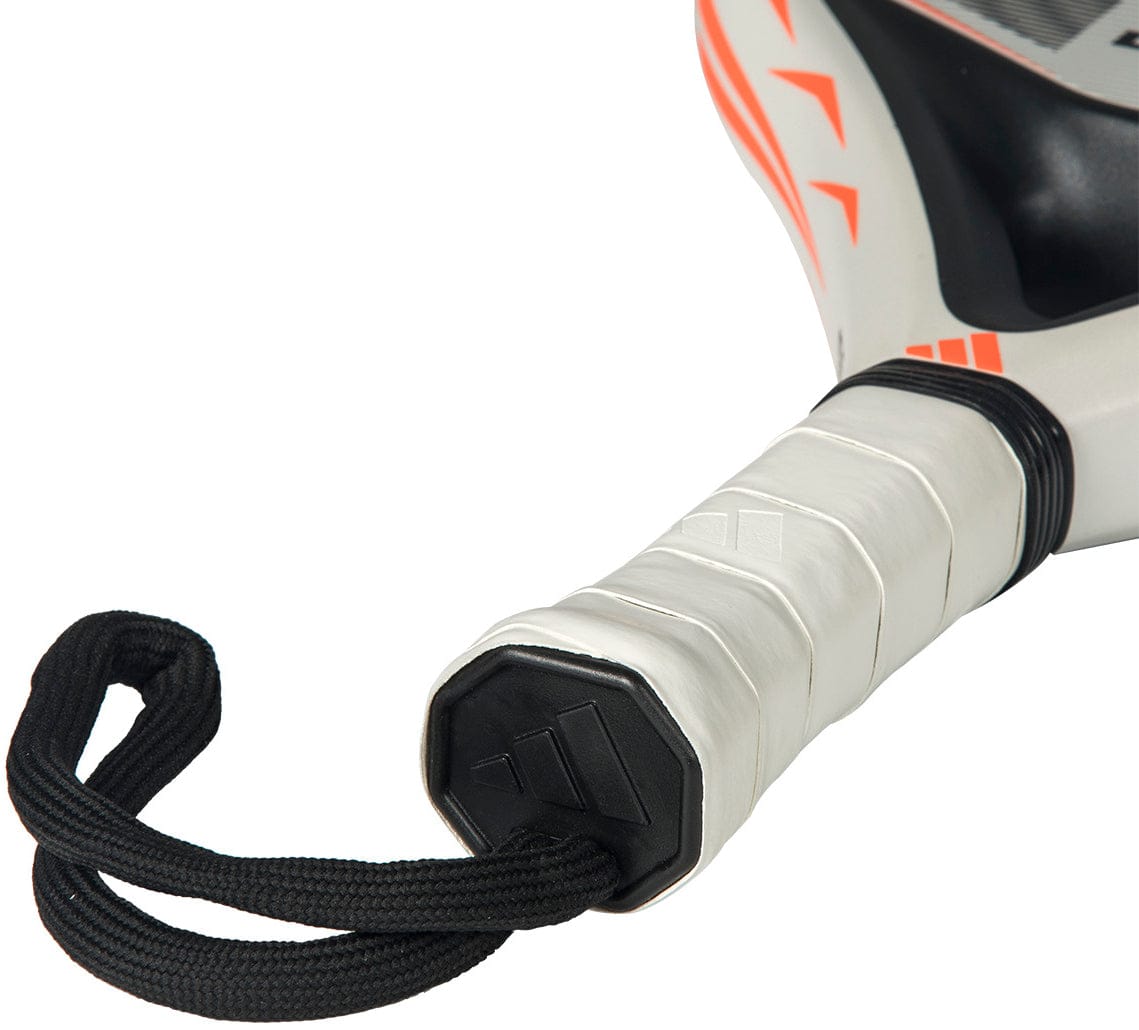 Close-up of the adidas Drive Light 2026 Padel Racket handle with a white grip, black wrist strap, and end cap featuring the logo. The edge is decorated with bold orange geometric accents.