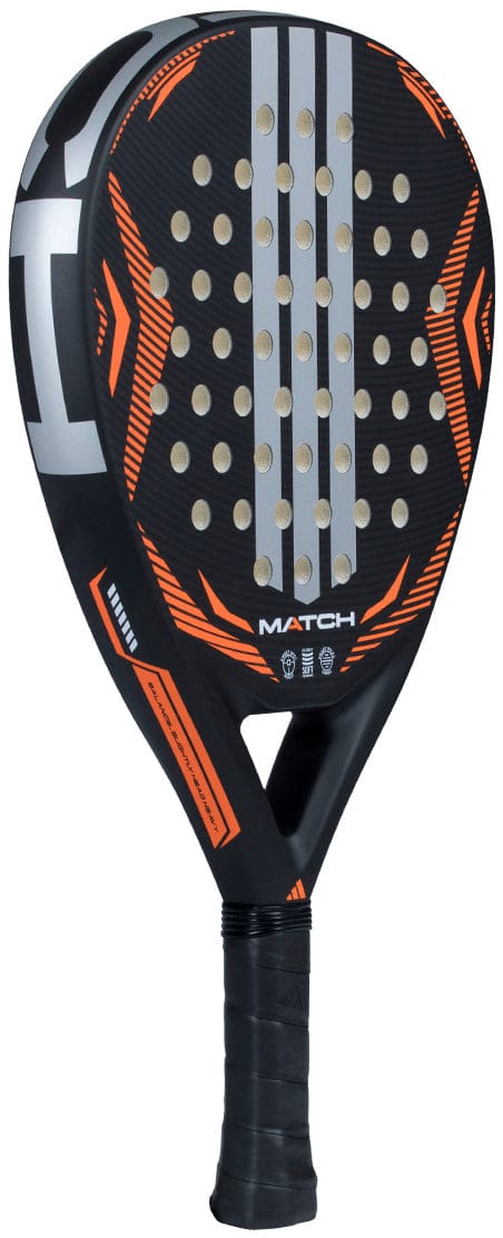 The adidas Match Black 2026 Padel Racket is a black teardrop racket with orange accents, silver stripes, small round holes, "MATCH" printed at the center, and a handle wrapped in black grip tape.