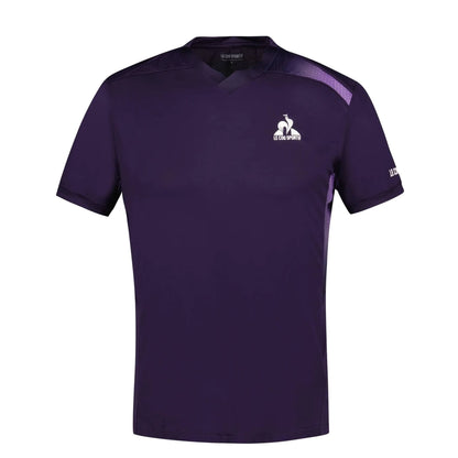 Introducing the Le Coq Sportif Pro Men's Padel T-Shirt in Deep Purple, designed for versatility with its short sleeves and V-neck to ensure breathability and ease of movement. This stylish top features a small rooster logo on the left chest, complemented by subtle black accents on the shoulders and sides.