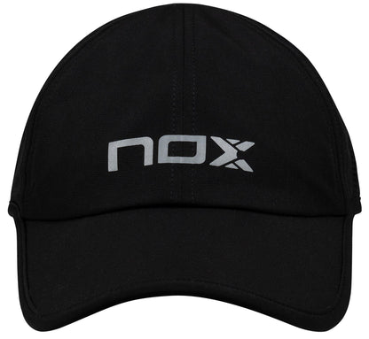 The NOX Padel Cap - Black / White features a white "nox" logo on the front, provides sun protection, and has an adjustable fit for comfort.
