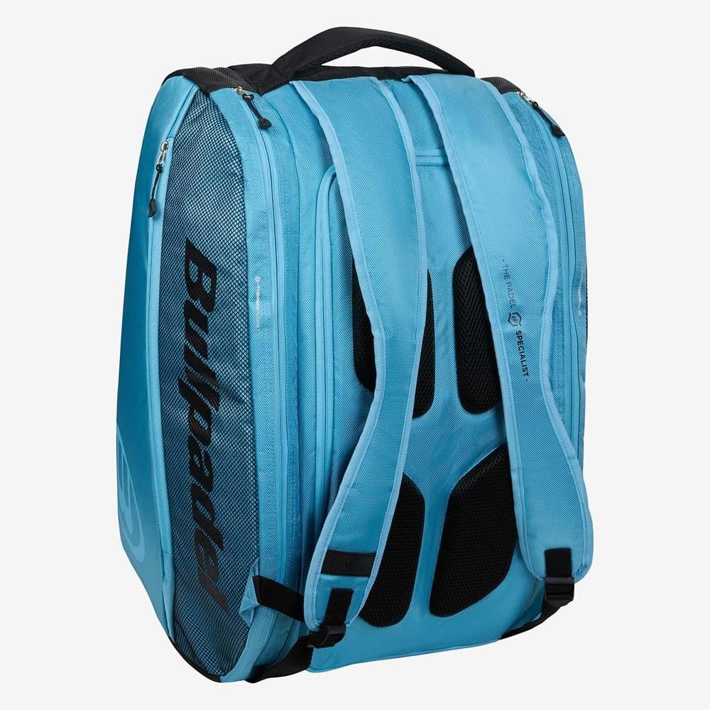 The Bullpadel BPP26003 Vertex W Padel Racket Bag in light blue is perfect for carrying your Bullpadel padel equipment, featuring black accents, mesh side pocket, padded straps, and a top handle.