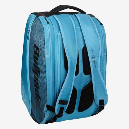 The Bullpadel BPP26003 Vertex W Padel Racket Bag in light blue is perfect for carrying your Bullpadel padel equipment, featuring black accents, mesh side pocket, padded straps, and a top handle.