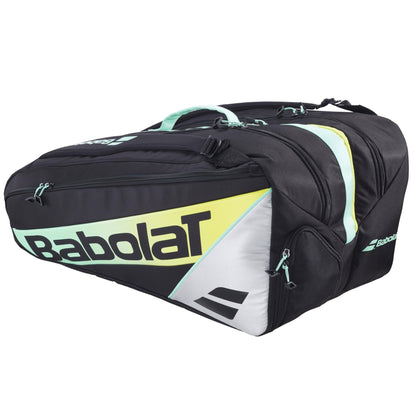 The Babolat RH Pro Padel Racket Bag – Black / Multi features multiple zippered compartments, an insulated racket section, large capacity, and displays the Babolat logo with light yellow and mint green accents.