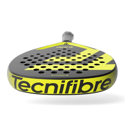A close-up of the Tecnifibre Bomba Soft Padel Racket showcases its black and yellow design with "Tecnifibre" boldly on the bottom edge. This racket offers comfort and a perforated surface for excellent playability.