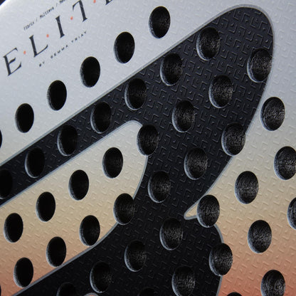 Close-up of the Bullpadel Elite W 2026 Padel Racket’s surface, showing its textured design, round holes, bold black letters, and the word "ELITE" partially visible on this lightweight women's racket by Bullpadel.