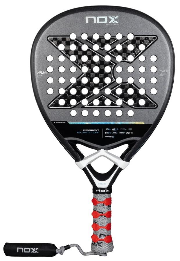 The NOX Luxury Quantum 12K Carbon 2025 Padel Racket is black, features a large X design, circular holes, a red and gray grip with wrist strap, and is made from durable 12K carbon fiber with EXCLUSIVE SPIN technology.