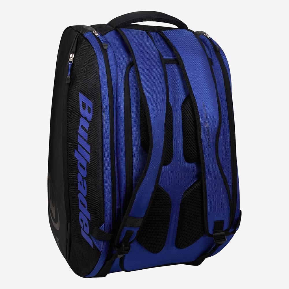 The Bullpadel BPP26002 Vertex Padel Racket Bag - Geo Blue features padded shoulder straps, several zippered compartments for your gear, and a side handle. It stands upright in blue and black against a plain white background.