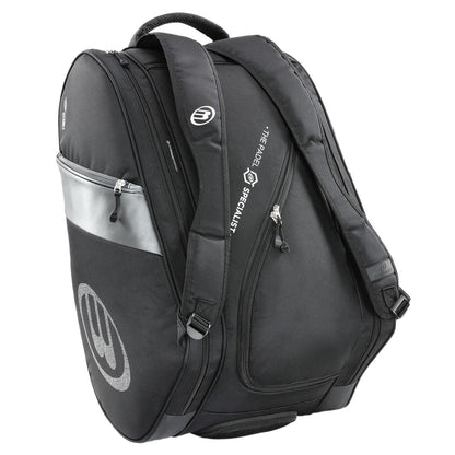 The Bullpadel Neuron 25 Padel Racket Bag in black is perfect for padel enthusiasts, featuring multiple compartments and two straps. A small front logo reads "The Padel Specialist" in white, making it ideal for your Flow Padel Racket.