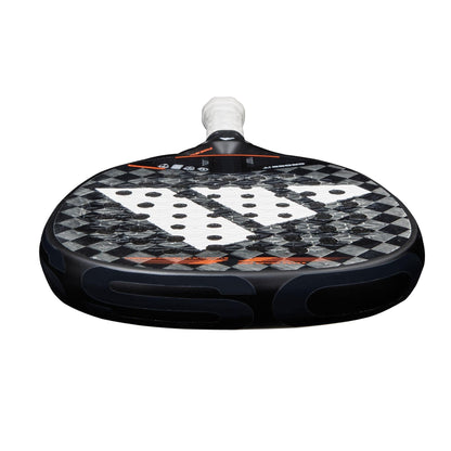 Close-up of the adidas Cross It 3.4 Padel Racket featuring a Carbon 15K face, diamond pattern, central holes, and white grip—ideal for aggressive players who want power and precision.