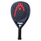 The HEAD Radical Pro 2024 Padel Racket features a dark blue and black design with red accents and logo, Auxetic technology, a perforated surface, “HEAD” and “Radical” labels, and a black grip handle for enhanced performance.