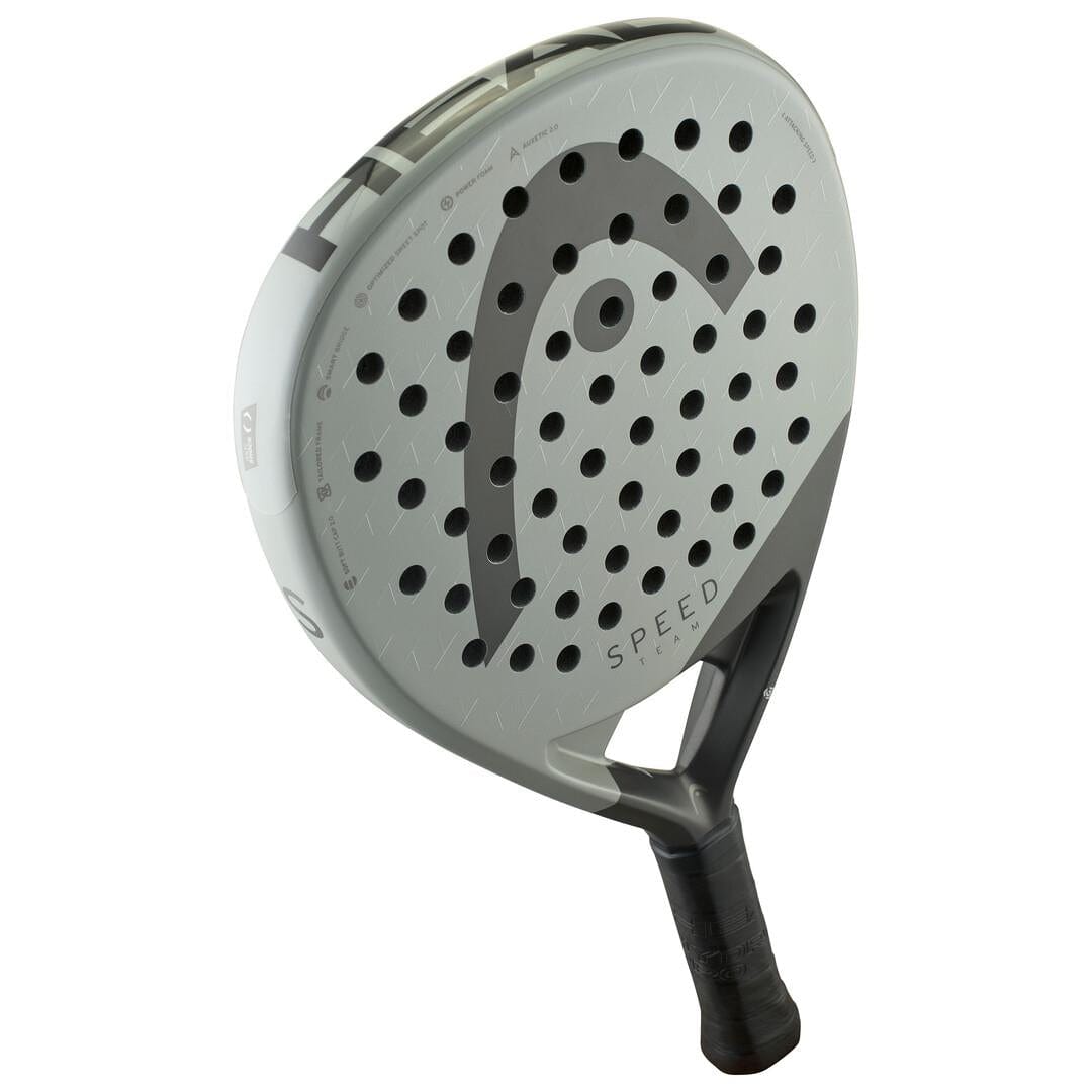 The HEAD Speed Team 2025 Padel Racket by HEAD features a gray design with a black handle, multiple circular holes, a large "C" logo, Auxetic 2.0 technology, and “Speed” printed near the top for power and control.