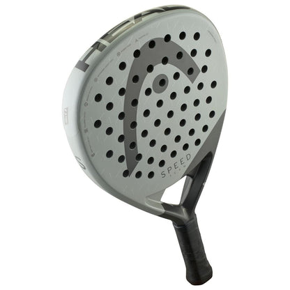 The HEAD Speed Team 2025 Padel Racket by HEAD features a gray design with a black handle, multiple circular holes, a large "C" logo, Auxetic 2.0 technology, and “Speed” printed near the top for power and control.