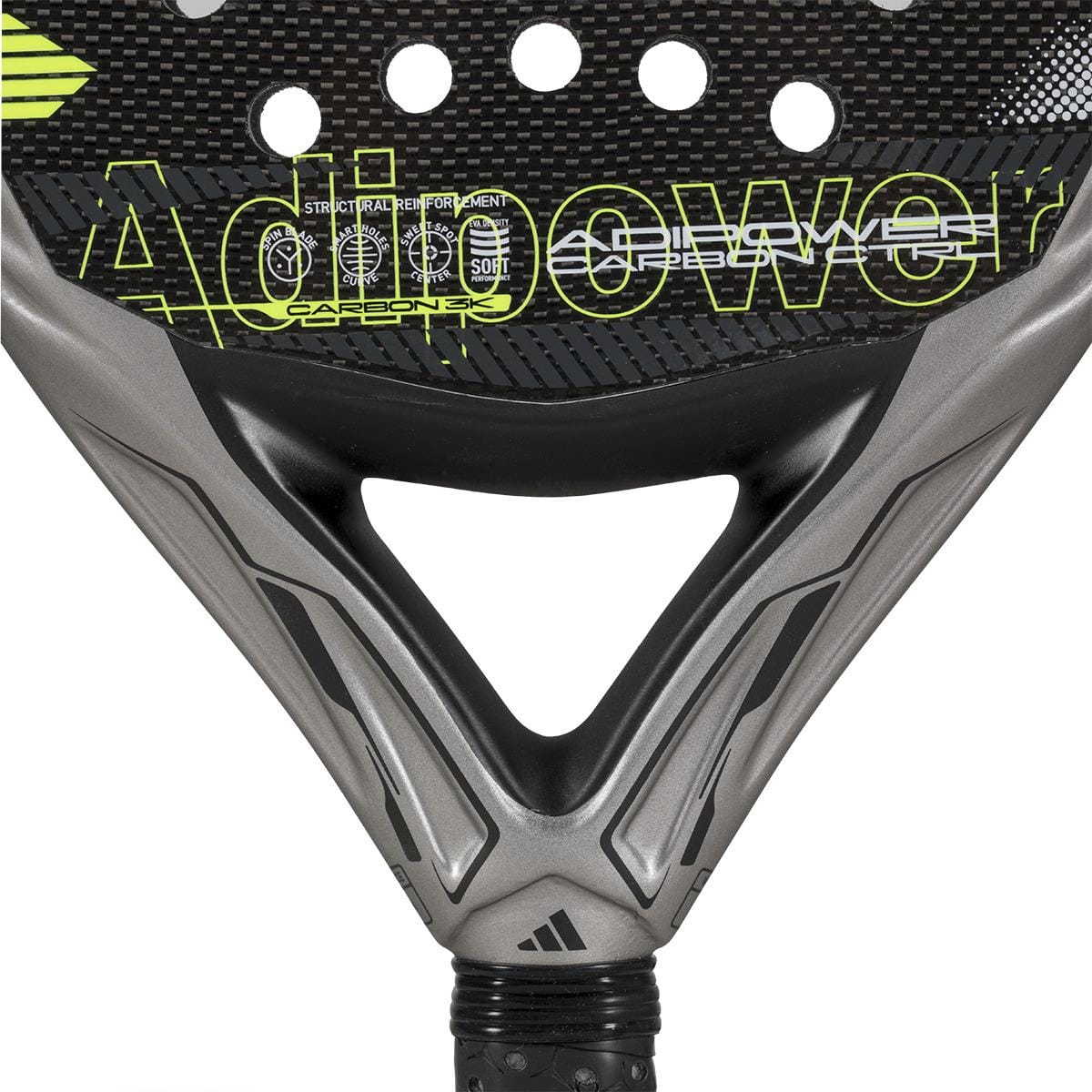 Close-up of the lower section of the adidas ADIDAS Adipower Carbon CTRL 3.4 Padel Racket in black and gray with yellow accents, featuring "Adipower" on its carbon 18K fiber surface.