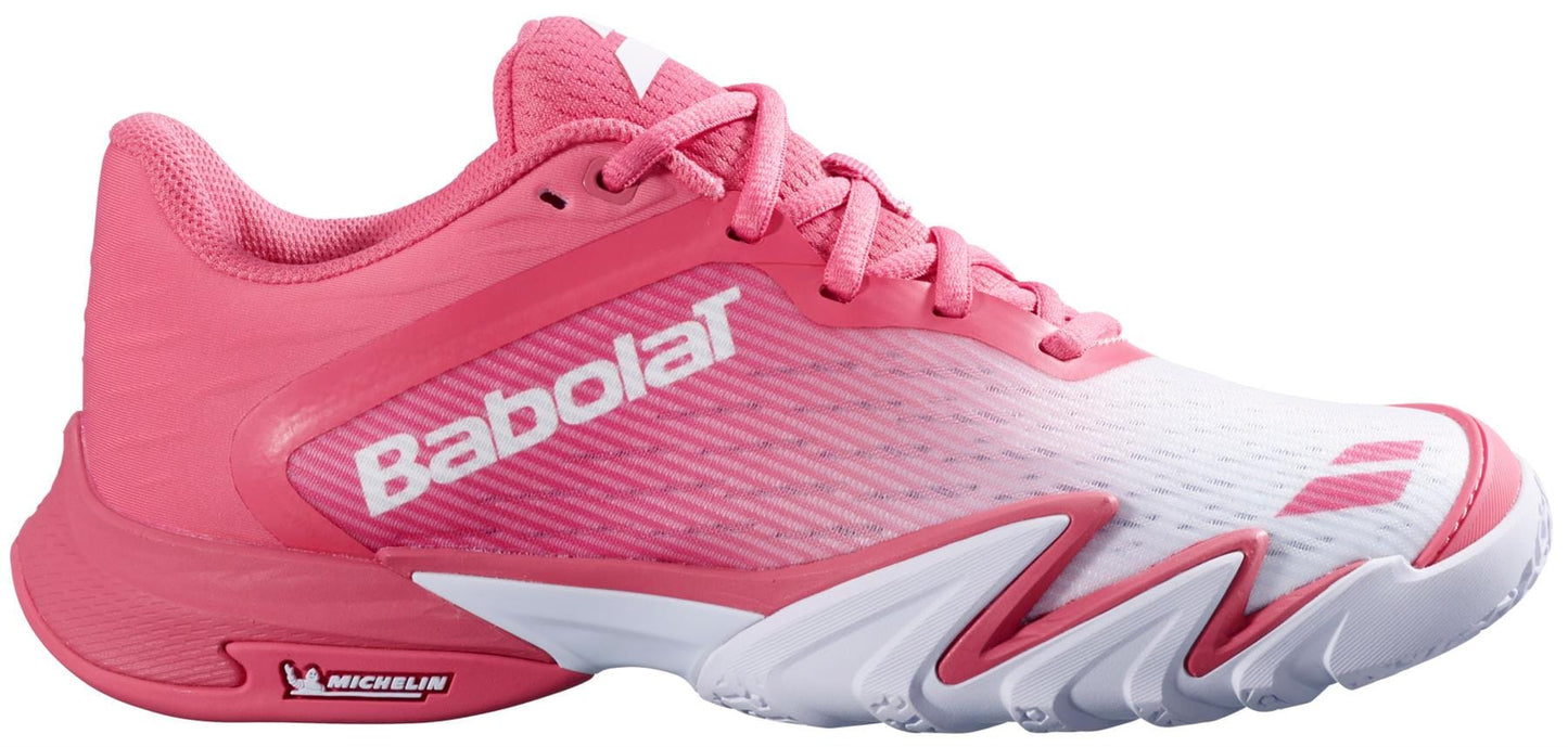 The Babolat Premura 3 Women's Padel Shoes in Sun Kissed Coral feature a pink and white design with pink laces, a white sole displaying the Michelin logo, and the Babolat logo near the heel and toe.