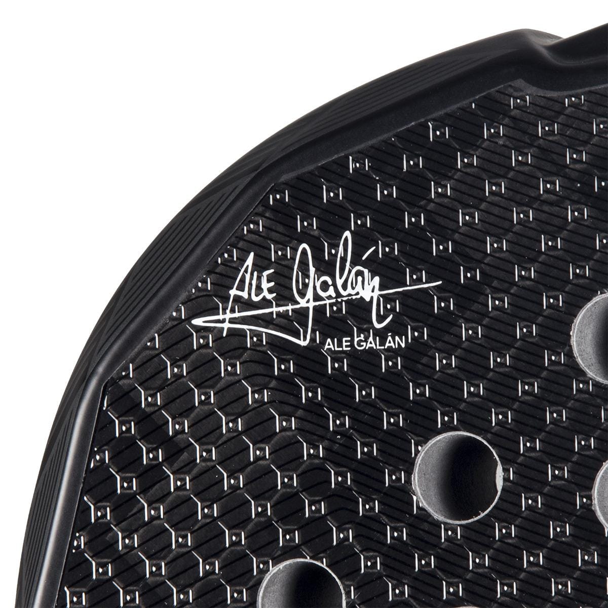 Close-up of the adidas Metalbone 3.4 Padel Racket, featuring a black design with a hexagonal texture, round holes, and Ale Galán’s white signature—engineered for advanced padel performance.
