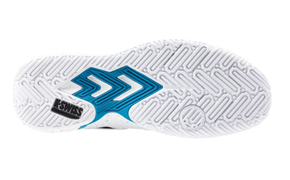 The image shows the underside of a K-Swiss Tura Team Mens Padel Shoe, featuring a durable white and blue geometric tread with chevrons and circular grooves for improved court grip. A black "K-SWISS" logo is positioned near the heel, making it ideal for traction-focused padel shoes.
