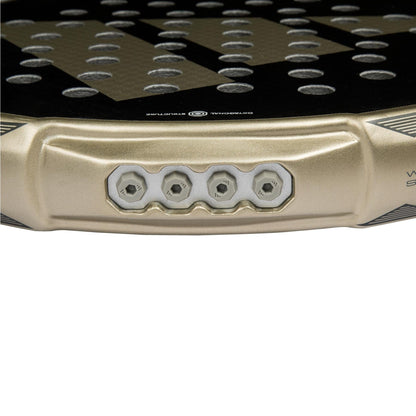 Close-up of the edge of the adidas Metalbone CTRL 3.4 Padel Racket, highlighting four hexagonal screw holes from its Weight and Balance System and a section of the perforated racket face.