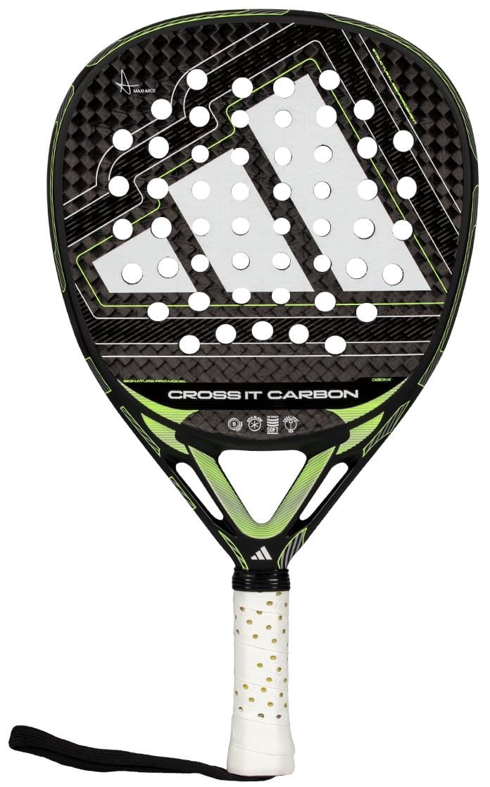 The adidas Cross It Carbon 2026 Padel Racket features a black and green design with a triangular logo, white perforated face, carbon fiber texture, gold-dotted white grip, and black wrist strap for advanced-level play.