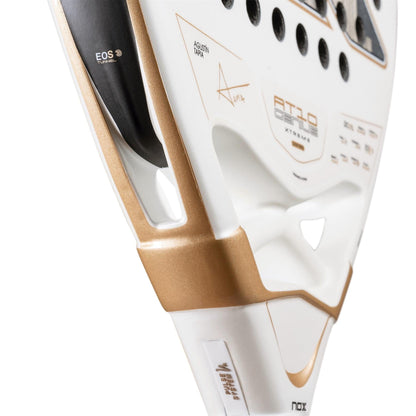 Close-up of the NOX AT10 Genius 12K Alum Extrem By Agustín Tapia 2026 Padel Racket showing its white and gold frame, black accents, textured surface, perforations, and prominent NOX brand logos.