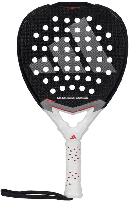 The adidas Metalbone Carbon 3.4 Padel Racket, in black and white, is ideal for advanced players and features a large adidas logo, round holes on the face, "METALBONE CARBON" above the handle, and a white grip with red accents.