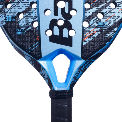 Close-up of the Babolat Air Veron Padel Racket’s blue and black teardrop head, showcasing a geometric pattern, circular holes, and the Babolat logo at the center for dynamic power.