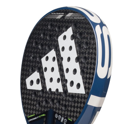 Close-up of the adidas Cross It Carbon CTRL Padel Racket, showing its black and blue design, white geometric logo, round holes, and visible specs near the handle. Made from durable carbon fibre for top performance.