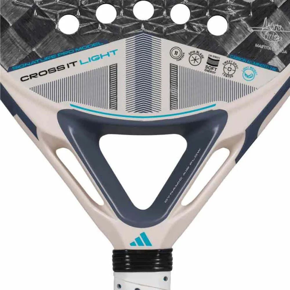 Close-up of the adidas Cross It Light 3.4 Padel Racket, a lightweight padel racket with "CROSS IT LIGHT" label and a geometric white, black, and blue design, plus adidas logos and technical details on its surface.