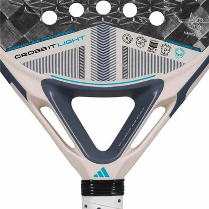 Close-up of the adidas Cross It Light 3.4 Padel Racket, a lightweight padel racket with "CROSS IT LIGHT" label and a geometric white, black, and blue design, plus adidas logos and technical details on its surface.