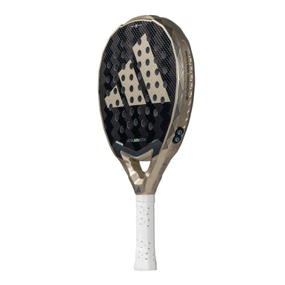 The adidas Metalbone CTRL 3.4 Padel Racket in beige and black features a perforated surface, bold adidas logo, white perforated grip handle, and an advanced Weight and Balance System for customizable play.