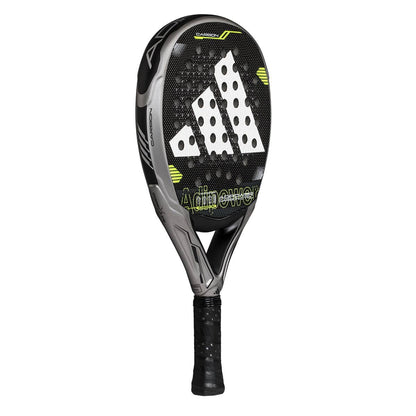 The adidas ADIDAS Adipower Carbon CTRL 3.4 padel racket is black and grey with yellow accents, a perforated face, white adidas logo, durable carbon 18K construction, and "Adipower" printed on the front.